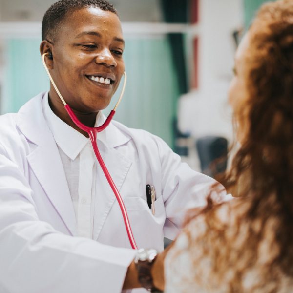 Physician examining a female patient